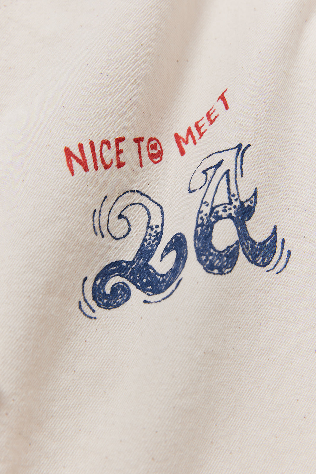 "NICE TO MEET...LA" ハンドペイントデニムシャツ